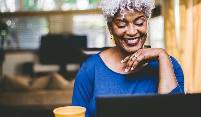 Mature African American female searching online for joint replacement information