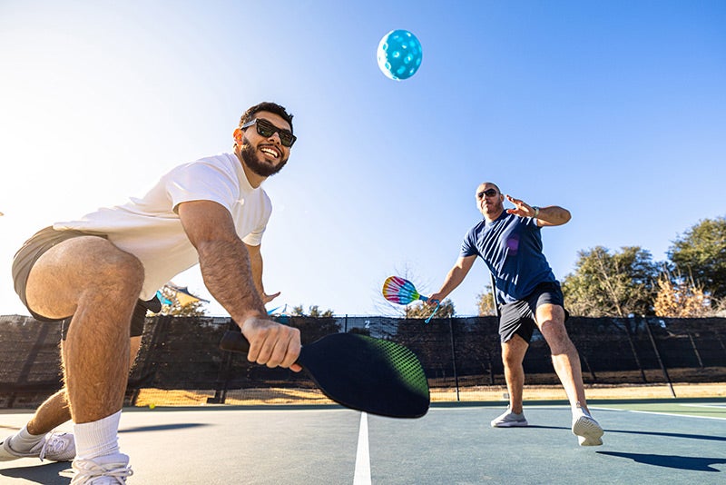 men playing pickleball